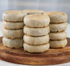 a stack of cookies sitting on top of a wooden cutting board