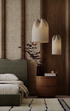 a bedroom with two lamps hanging from the ceiling