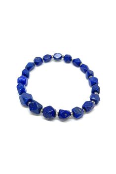 This brilliant Lapis Lazuli stretchy bracelet has been shaped into angled beads. Pair this bracelet with any outfit to add a 'pop' of beautiful blue. Lapis Lazuli dates back to 5000 B.C. and has been highly prized since ancient Babylonian and Egyptian times. The stone is mined in Chili, Siberia, Myanmar, and the United States. Lapis Lazuli, a manifestation stone, is excellent for meditation. It is believed to provide strength, wisdom, and truth. Measurements: 9" long Luxury Blue Lapis Lazuli Beaded Bracelets, Blue Beaded Flexible Stretch Bracelet, Blue Stretch Bracelet With Polished Beads As Gift, Flexible Blue Beaded Stretch Bracelet, Blue Beaded Stretch Bracelet, Flexible Blue Beaded Bracelets, Flexible Blue Stretch Bracelet As Gift, Gift Blue Stretch Bracelet With Polished Beads, Adjustable Lapis Lazuli Beaded Bracelet With Faceted Beads