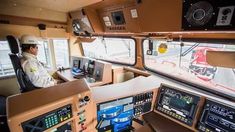 a man sitting in the cockpit of an airplane