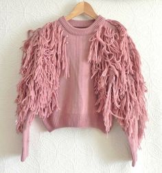 Unique Sweater                                                              . Material - Unmarked. Appear to be Acrylic                                     . Lining - No                                     . Color – Rustic Pink                                     . Sleeve – Long Sleeve                                     . Closure – Crew Neck. Pullover                                     . Pocket - None                                                                           . Style – Cropped, Trendy Fringe Tops For Winter, Unique Sweater, Sweater Cropped, Unique Sweaters, Cropped Pullover, Sweater Crop, Sweater Material, Fringe Trim, No Color