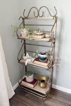 a metal shelf with pots and bowls on it