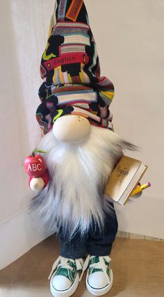 a stuffed animal with books on it's back