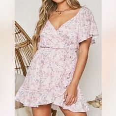 Brand : Peach Love California Size : S Bust 38” Hip 42” Length 34” M Bust 40” Hip 44” Length 34” L Bust 42” Hip 46” Length 34” Color : Pink Material : Polyester Condition : New Flutter Sleeve Mini Dress Floral Print Flowy Feminine Floral Dress For Brunch, Feminine Flowy Floral Dress For Brunch, Peach V-neck Dress For Brunch, Flirty V-neck Floral Dress For Vacation, Flowy Short Sleeve Floral Dress For Brunch, Pink Floral V-neck Dress For Brunch, Flowy Short Sleeve Floral Brunch Dress, Feminine Fitted Floral Dress With Surplice Neckline, Feminine Mini Dress For Brunch With Short Sleeves