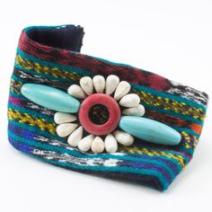 Guatemala is a rich tapestry of Mayan culture, traditions and hand woven textiles!  Our collection would not be complete without this one of a kind fabric bracelet.  Our talented artisan, Natalia, hand beaded on top and created our very own beaded closure.  No need to be intimidated by this style, throw it on with your favorite t-shirt and jeans to add a little Mayan flavor to your classic look! RETIRING SOON - Limited quantity available, so order yours today!  Length:  7 ½" with an extender chain for adjustable length to 9" Multicolor Folk Style Festival Jewelry, Traditional Fair Trade Bracelets For Festival, Traditional Fair Trade Festival Bracelets, Artisan Fair Trade Bracelets For Festivals, Traditional Fair Trade Friendship Bracelets, Fair Trade Beaded Bracelet For Festivals, Adjustable Traditional Cuff Bracelet With Colorful Beads, Bohemian Multicolor Fair Trade Beaded Bracelets, Traditional Adjustable Cuff Bracelet With Colorful Beads