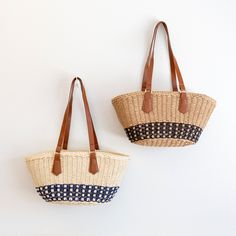 IN STOCK FAST SHIPPING FROM LOS ANGELES Take on the summer with our handmade straw bag! With a large opening and inner pocket, this beach bag is perfect for all your sunny essentials. Simple, durable, and oh-so-cool, this basket bag is the ultimate summer companion. Get ready to turn heads with this unique, stylish statement piece! Plus, it's made with love and care for a unique and stylish statement that's sure to turn heads. Who says functional can't be fun? Get your beach fashion game on point with this versatile and playful bag! High Quality Synthetic Leather Strap Inner Lining with Zipper Closure Size: 7"H x 15"W x 6.5"D Strap drop length: 11" Designer Style ID: 8637 Straw Basket, Straw Bags, Raffia Bag, Basket Bag, Denim Bag, Knitted Bags, Beach Style, Beach Bag, Canvas Bag