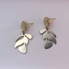 Stand out wherever you go with these Monstera-shaped earrings. These smaller dangles are perfect for those trying to break their stud routine. They have an ultra-light and durable botanic design that can give a little jungle glam. Note: This earring design is not available in Silver Trendy Leaf-shaped Earrings For Gifts, Leaf-shaped Metal Earrings As Gift, Metal Leaf Shaped Earrings, Metal Leaf-shaped Earrings As Gift, Pierced Leaf-shaped Metal Earrings, Metal Leaf-shaped Pierced Earrings, Minimalist Cadmium-free Dangle Earrings, Nickel Free Leaf-shaped Metal Earrings, Nickel-free Leaf-shaped Metal Earrings