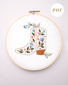 Floral cowboy boot hand embroidery pattern with pink and blue flowers and light green leaves Horse Hand Embroidery Designs, Hand Embroidery Designs Free, Western Embroidery Designs, Bookshelves Inspiration, Texas Embroidery, Cowboy Embroidery, Embroidery Guide, Mom Embroidery, Landscape Embroidery