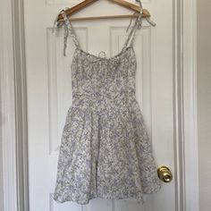 Nwt Floral Mini Dress With Tie Straps And Zippered Back. The Top Of Dress Has A Big Of Structure To It, While The Bottom Has A Nice Flow. No Pockets. Dress Is Lined, Though No Pads To Breast Area. Floral Print Sundress For Casual Wear, Cotton Floral Sundress For Brunch, Dress With Tie Straps, Dress With Tie, Dresses Floral, Floral Mini Dress, Colorful Dresses, Mini Dress, Womens Dresses