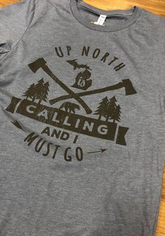 Michigan Grey Up North is Calling Short Sleeve Fashion T Shirt Gray Graphic Tee With Front Print, Gray Crew Neck T-shirt For Outdoor Activities, Heather Grey Graphic Tee With Letter Print, Tri-blend Graphic Tee With Sublimation Print, Graphic Tee With Sublimation Print In Tri-blend Fabric, Cotton T-shirt With Letter Print For Camping, Gray Crew Neck Top For Outdoor Activities, Gray Crew Neck Top For Outdoor, Heather Grey Tri-blend T-shirt With Screen Print