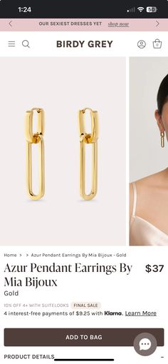 a pair of gold earrings on display in a storefront page, with an ad for the