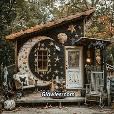 a small house with stars and moon decorations on it