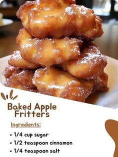 a pile of baked apple fritters sitting on top of a white plate