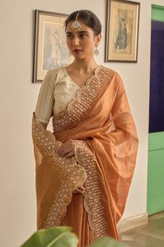 Rust saree with scallop trimmed, floral hand embroidery. Paired with a cream blouse with stripe pattern. - Aza Fashions Festive Pre-draped Saree With Embroidered Border In Cotton Silk, Festive Cotton Silk Pre-draped Saree With Embroidered Border, Traditional Cotton Silk Pre-draped Saree With Embroidered Border, Elegant Slub Silk Blouse With Dupatta, Eid Reception Slub Silk Blouse Piece, Transitional Pre-draped Cotton Silk Saree With Embroidered Border, Anarkali Pre-draped Saree With Embroidered Border For Reception, Anarkali Pre-draped Saree For Reception With Embroidered Border, Embroidered Reception Pre-draped Saree