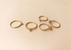 Bell rings. by Studio Baladi Minimalist Recycled Gold Stackable Toe Rings, Minimalist Stackable Recycled Gold Midi Rings, Minimalist Stackable Midi Rings In Recycled Gold, Minimalist Stackable Midi Rings As Gift, Minimalist Toe Ring Jewelry With Ring Detail, Minimalist Toe Ring With Ring Detail, Minimalist Toe Ring With Detail, Minimalist Brass Ring Jewelry, Minimalist Brass Ring