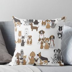 a group of dogs sitting on top of a couch next to each other throw pillow