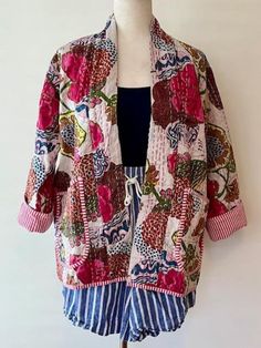 Perfect for adding a burst of color and flair to your wardrobe. This japanese style open jacket is made with embroidery patchwork kantha quilt fabric which is fresh and new. The hand stitching is the specialty of the piece you will see. The jacket is not reversible, but we love to showcase the pinstripes inside by adding a roll or two on the sleeves.  You really get a feel for the playful mix of hues and patterns which bring a lively, artistic touch to any outfit, while the lightweight fabric ensures comfort and versatility. Pair with your favorite palazzo pants, or over a long silk tank dress.   Color: White  Price: $ 100  Size : One size US women's letter Measurements Approx : *Length: 28" Inches *Bust Around Size: 48" Inches *Shoulder: 8" Inches *Sleeve Length: 18" Inches *Sleeve hole: Embroidery Patchwork, Silk Tank Dress, Kantha Jacket, Open Jacket, Silk Tank, Kantha Quilt, Palazzo Pants, British Indian, Japanese Style