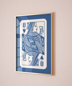 a blue and white ace playing card mounted on a wall