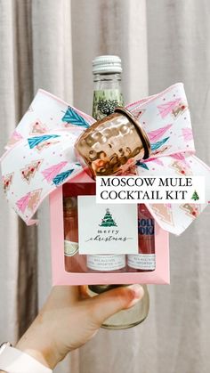 the moscow mule cocktail kit is in a pink gift box with a bow on it