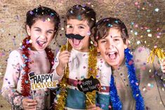 three young children with fake mustaches and confetti