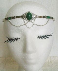 Green Agate Circlet This beautiful circlet has metal chain, sterling silver plated accents, sterling silver plated pendant and green agate settings. Adjustable. Adjustable Victorian Jewelry With Jewels, Adjustable Victorian Style Jewelry With Jewels, Victorian Style Adjustable Nickel-free Jewelry, Handmade Elegant Festival Headpiece, Elegant Handmade Festival Headpiece, Victorian Metal Jewelry For Ceremonial Occasions, Medieval Silver Wedding Jewelry, Victorian Green Metal Jewelry, Elegant Handmade Teardrop Crown Headpiece