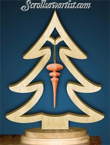 a wooden christmas tree decoration with an ornament hanging from it's center