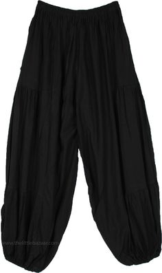 These perfect pair of loose rayon harem pants - without the usual tie-dye- are just what you may need for the season, with their comfy fabric and snug waist they are sure to make you feel great.  The pants have an elastic waist and elastic on the ankles for ease of comfort. #tlb #SplitSkirtsPants #Yoga #blackhippieharempants #gypsyblackpants Comfortable Black Wide-leg Harem Pants, Spring Solid Harem Pants, Relaxed Fit Solid Harem Pants, Solid Relaxed Fit Harem Pants, Loosely Fitted Rayon Harem Pants With Elastic Waistband, Solid Cotton Bohemian Harem Pants, Solid Bohemian Cotton Harem Pants, Haram Pants, Black Hippie