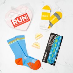 Shine bright on your runs with our limited edition RUNBOX� full of gifts any runner will love and appreciate. The RUNBOX� is packed with amazing running accessories and gifts for only $35.00! Quantities are limited so grab this thoughtfully curated RUNBOX� before this awesome deal runs away. The perfect gift to celebrate the joys of running. Long Dostance Runner Gifts, Sole Sisters, Mother Runner, Love Run, Runner Girl, Running Accessories, Heart Shape Box, Calf Socks, Curated Gifts