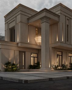 a large beige building with columns and lights