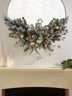 a fireplace mantel with a mirror and christmas decorations on it, along with other holiday items