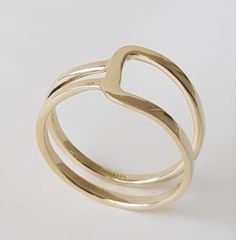 14K solid gold ring in a minimalist style for lovers of geometric shapes. ◈ DETAILS Weight: 3g Width upper part-9mm / 0.35'' Thickness-1.3 mm / 0.05'' ◈ MATERIAL 14K Solid Gold - Smooth,shiny,plain surface ◈ ALSO AVAILABLE IN 14K/18K/9K Yellow, Rose, or White Gold ◈ ENGRAVING is optional ◈ SHIPPING is insured express and free worldwide ◈ GIFT WRAPPING is included with every purchase ✧ Back to my shop for more handcrafted gold jewelry: https://etsy.me/38Cs5Zl If you have any questions, I will be Adjustable Yellow Gold Stackable Rings Modern Style, Modern Adjustable Yellow Gold Stackable Rings, Modern Adjustable Stackable Yellow Gold Rings, Modern Everyday Stackable Rings With Open Band, Minimalist Yellow Gold Stackable Rings With Open Band, Minimalist Gold Couple Rings With Open Band, Modern 14k Gold Open Band Ring, Modern Yellow Gold Double Band Rings, Modern Stackable Open Band Midi Rings