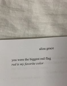 a piece of paper that is laying on top of a bed with the words, you were the biggest red flag red is my favorite color