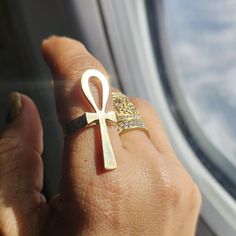 Ankh Ring Silver, gold, statement ring, Egypt, protection a Symbol of Eternal Life. Embrace the timeless symbolism of the Ankh with this beautifully crafted ring, available in both gold and silver.  The Ankh, known as the ancient Egyptian symbol of eternal life, is elegantly represented in this design, making it a powerful statement piece. The ring's sleek and minimalist design allows the symbol to shine, while the choice of gold or silver adds a touch of luxury and sophistication.  Perfect for Elegant Ankh-shaped Metal Jewelry, Gold Cross Rings With Spiritual Style, Symbolic Open Ring Jewelry With Polished Finish, Symbolic Open Ring With Polished Finish, Symbolic Hand Forged Ring Jewelry, Symbolic Rings With Unique Design For Gift, Silver Brass Rings Fine Jewelry, Symbolic Hand Forged Open Ring, Gold Engraved Metal Ring As Gift