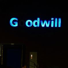 there is a neon sign that says god will