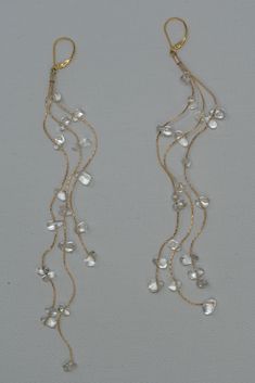 Cascading crystal clear quartz droplets on 14k GF barely there cordette chain. Leverback Earring post. These dramatic earrings fall just over 5'' to dust the shoulders. Chain Earrings Dangle, Prom Jewellery, Clear Quartz Jewelry, Crystal Bead Earrings, Cascade Earrings, Long Crystal Earrings, Crystal Quartz Earrings, Dramatic Earrings, Aesthetic Decoration