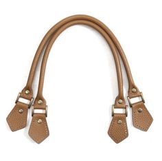 three brown leather straps hanging from the side