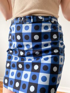 Size: Small 28" waist 15" long 36" hips + DETAILS some stretch in the material This charming mini skirt with retro dotted square print in shades of blue and black throughout. The A-line silhouette is nipped in by the back zipper Material: no tag but guessing 100% polyester Care: machine wash, line dry, wash with similar colors spot clean belt Condition: Like New (Condition Guide) Product From Greece ♥ Sustainable + Ethical Need Help? Live Chat with us Call us 226-791-0219 Shipping Information Returns & Exchanges Size Guide FAQ Skirt With Belt, Retro Blue, Square Print, Blue Square, Live Chat, Shades Of Blue, Size Guide, Mini Skirt, Pencil Skirt