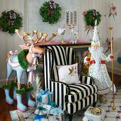 a living room filled with furniture and christmas decorations