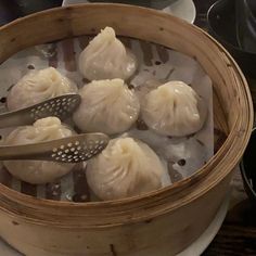 some dumplings are being cooked in a steamer