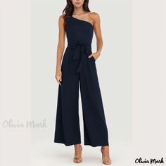 Olivia Mark - Stylish Off-Shoulder Jumpsuit with a Solid Color and Strappy Detail Chic Off-shoulder Blue Jumpsuit, Elegant One-shoulder Blue Jumpsuits And Rompers, Elegant Blue One-shoulder Jumpsuit, Solid One-shoulder Jumpsuits And Rompers For Date Night, One Shoulder Solid Jumpsuit For Date Night, One-shoulder Solid Jumpsuits And Rompers For Date Night, One Shoulder Solid Jumpsuits And Rompers For Date Night, Chic Navy Sleeveless Jumpsuits And Rompers, Chic Blue One-shoulder Jumpsuit