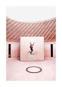 a monogrammed image of a person jumping in the air over a building with a circular floor mat