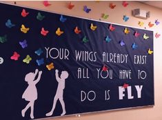 a bulletin board with paper cut outs on it that says, your wings already exist all you have to do is fly