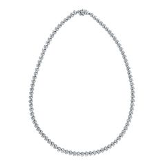 A classic and elegant everyday or occasional wear the Directions Diamond Tennis Necklace is a timeless and versatile piece of jewelry. All our necklaces have two locks for added security. Total Diamond Weight: 9.00 ct Diamond Color: H - I Diamond Clarity: SI - I (Slightly Included - Included) Metal: 14K White Gold Metal Wt: 21.30 gms Setting: Prong Set Length: 16 Inches (40.6 cm) Classic Round Diamond Necklace For Everyday Luxury, Classic Bridal Necklace With Round Diamond Accents, Classic Bridal Necklace With Diamond Accents, Silver Diamond Necklace With Single Strand, Silver Single Strand Diamond Necklace, Timeless Silver Solitaire Necklace Single Strand, Timeless Silver Solitaire Single Strand Necklace, Formal Single Strand Round Diamond Necklace, Formal Single Strand Diamond Necklace