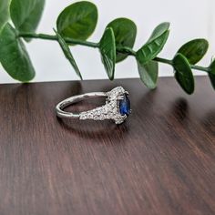 This ring design is a tried and tested NNJ Designs favorite! Featuring a gorgeous Ceylon blue sapphire with a stunning diamond halo and accented shank that elevates this ring to a gorgeous statement piece, all set in solid 14k gold! This ring is made with solid 14K Gold and naturally Earth-mined SI / G-H diamonds. As listed, this ring is ready to ship. If you're interested in purchasing this setting with a different center stone please message us! Blue Halo Ring With Diamond Accents, Blue Halo Ring With Diamond Accents Round Cut, Blue Moissanite Diamond Ring With Halo Setting, Blue Halo Ring With Diamond Accents For Wedding, Sapphire Moissanite Diamond Ring With Halo Setting, Blue Sapphire Ring With Moissanite And Halo Setting, Designer Silver Jewellery, Ceylon Blue Sapphire, Blue Sapphire Ring