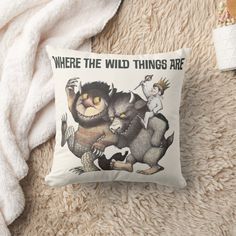 there is a pillow with an image of two animals on it and the words where the wild things are