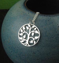 Tree of life necklace in sterling silver, family tree, silver tree charm, sterling silver tree necklace, heirloom jewelry, nature, mother's day A sterling silver tree of life charm is suspended from a sterling silver chain that can be up to 22 inches in length. It is secured with a sterling silver spring clasp. You can choose from a small tree charm that measures 15mm (0.59 inches) in diameter, a medium tree that measures 20mm (0.79 inches) in diameter, or a large tree that measures 30mm (1.18 i Nature-inspired Sterling Silver Jewelry For Mom, Sterling Silver Nature-inspired Necklace For Anniversary, Nature-inspired Sterling Silver Necklace For Anniversary, Personalized Sterling Silver Nature-inspired Necklaces, Personalized Nature-inspired Sterling Silver Necklaces, Sterling Silver Tree Of Life Nature-inspired Jewelry, Silver Tree Of Life Jewelry For Mother's Day, Sterling Silver Tree Of Life Round Pendant, Sterling Silver Tree Of Life Round Pendant Necklace