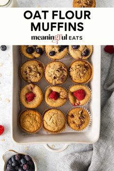 oat flour muffins in a baking dish with berries and blueberries on the side