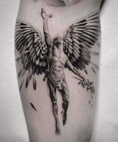 a man with an angel tattoo on his leg