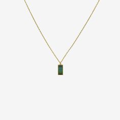 Details Lola Brooks 18k & mirror-cut blue green tourmaline necklace, 3.10cts. The stone measures approximately 1/2″ x 1 1/4″ & is set in Lola's signature fine closed bezel setting. The pendant hangs from an 18", 18k yellow gold chain. - blue green tourmaline - 18k yellow gold - 18" total length Green Tourmaline Necklace In Fine Jewelry Style, Formal Green Tourmaline Necklace, Formal Green Necklace With Rectangular Pendant, Green Rectangular Pendant Necklace For Formal Occasions, Green Gemstone Necklace With Rectangular Stone, Tourmaline Pendant, Tourmaline Necklace, Yellow Gold Chain, Green Tourmaline