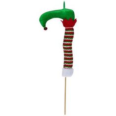 an elf hat on top of a toothpick with a green and red stripe